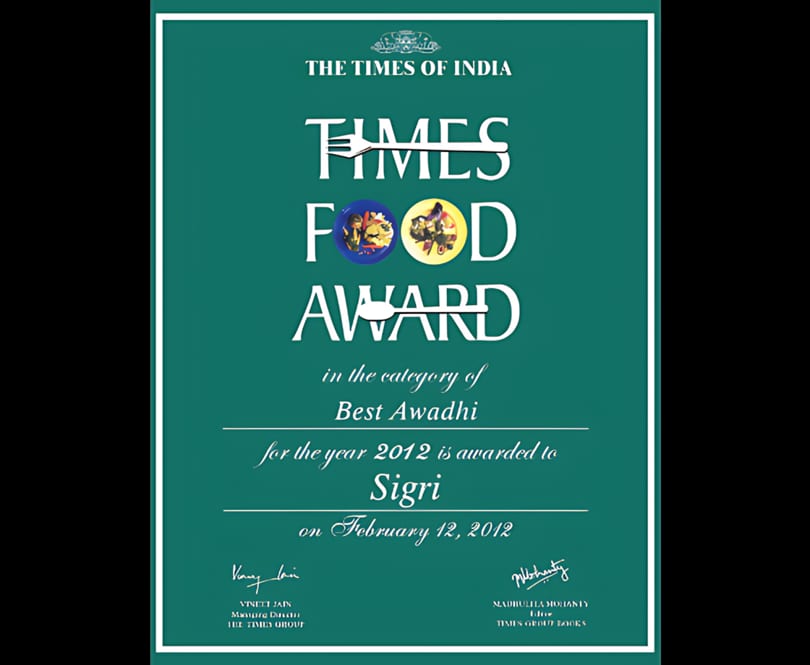 A green certificate for "The Times of India Food Award" for Best Awadhi cuisine, awarded to Sigri.